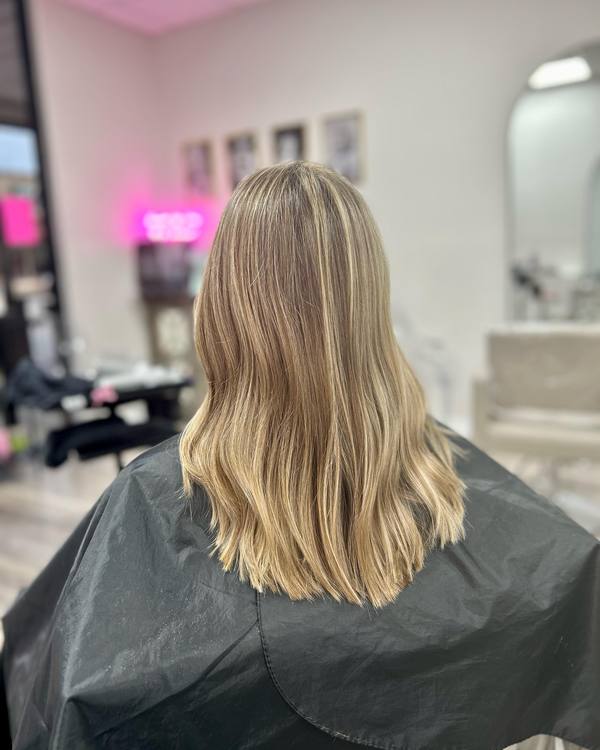A soft blonde balayage, seen from the back