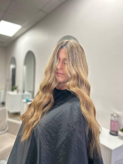 Long blonde waves with a darker root